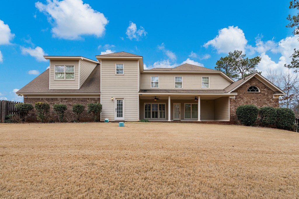 8026 Splendor Way Columbus, GA 31904 - Photo 37 of 44 a front view of a house with a yard and garage
