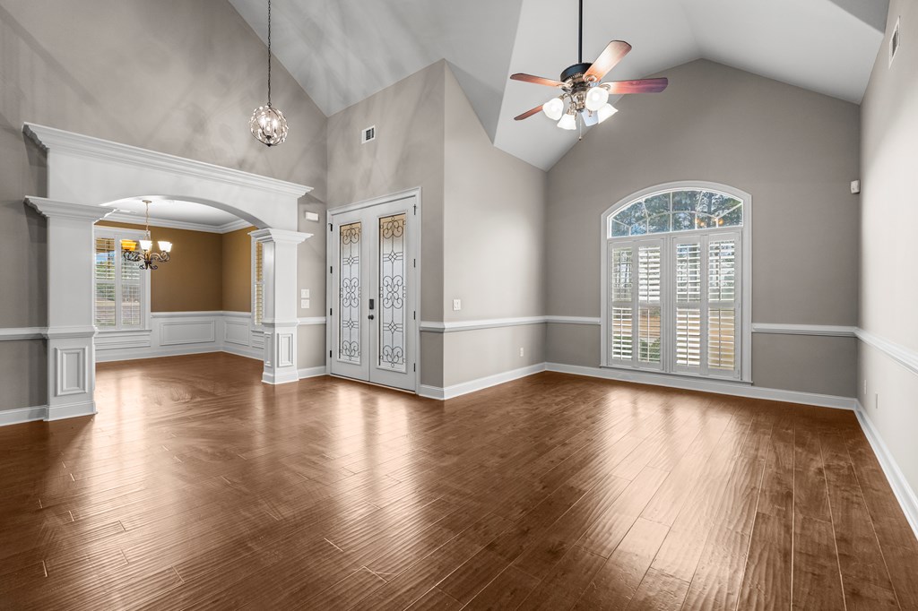 8026 Splendor Way Columbus, GA 31904 - Photo 6 of 44 a view of an empty room with wooden floor and a window