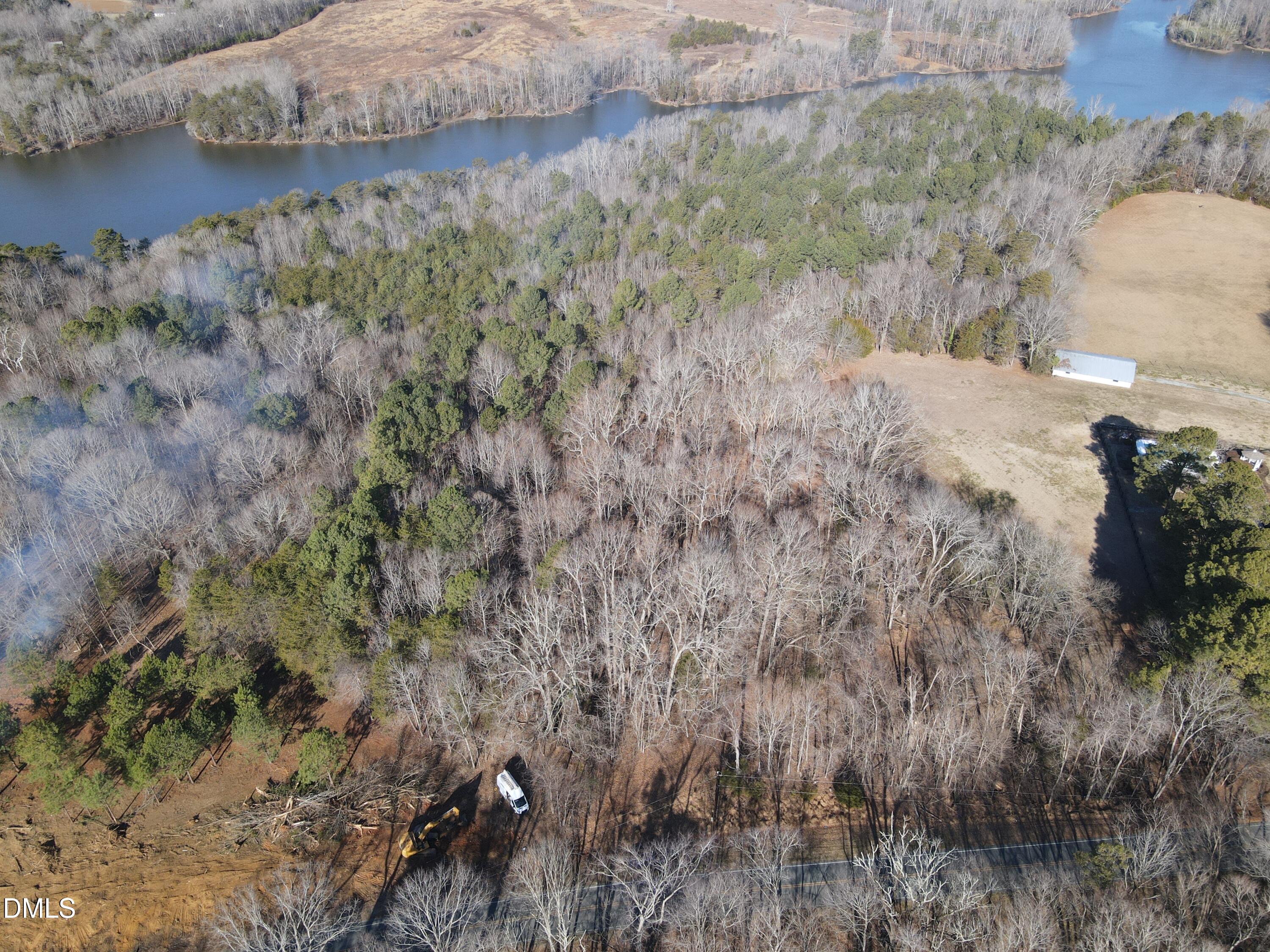 0 Bason Road Mebane, NC 27302 - Photo 4 of 34 a view of a yard next to a road