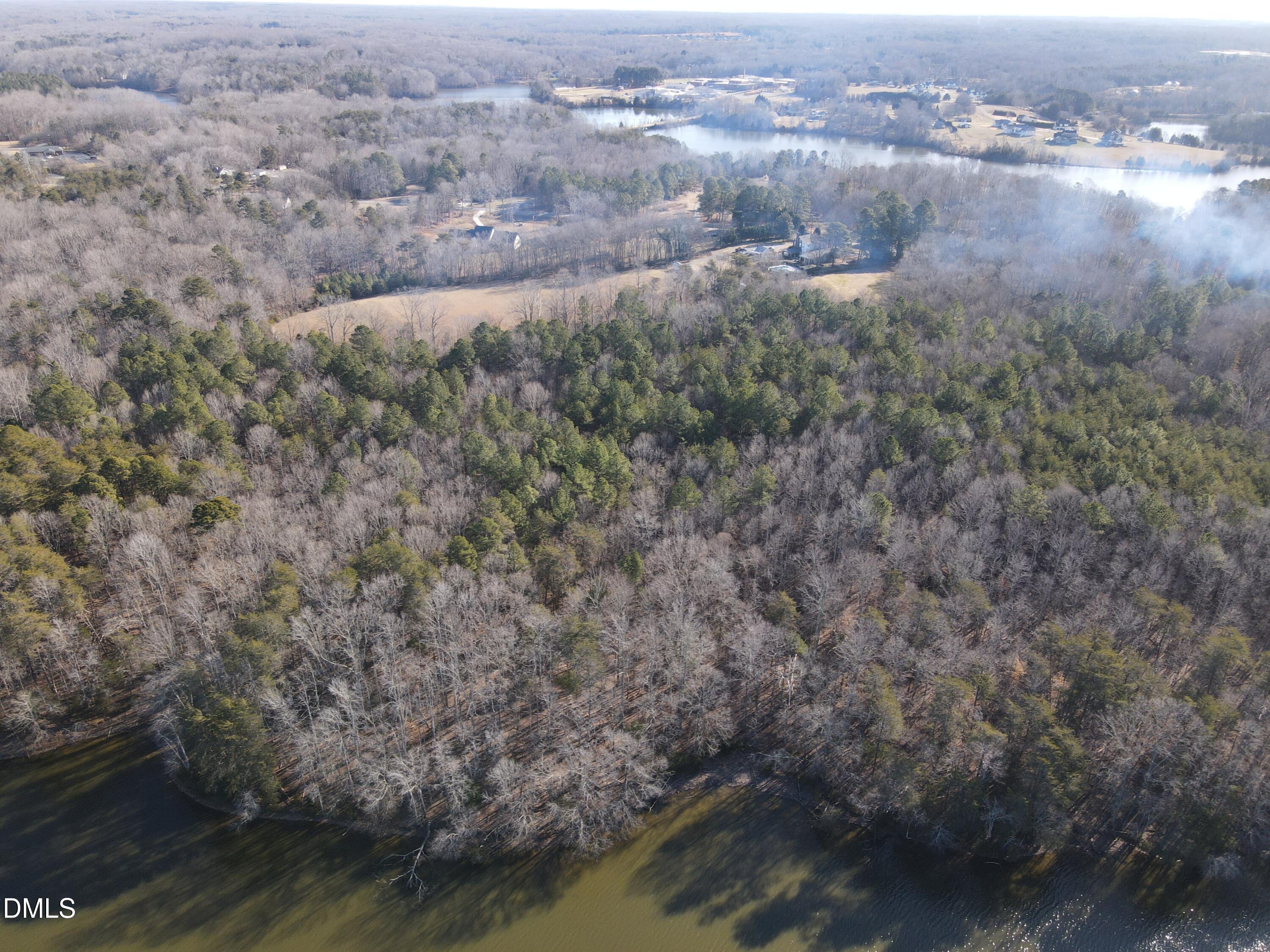 0 Bason Road Mebane, NC 27302 - Photo 9 of 34 an aerial view of house with yard and lake view