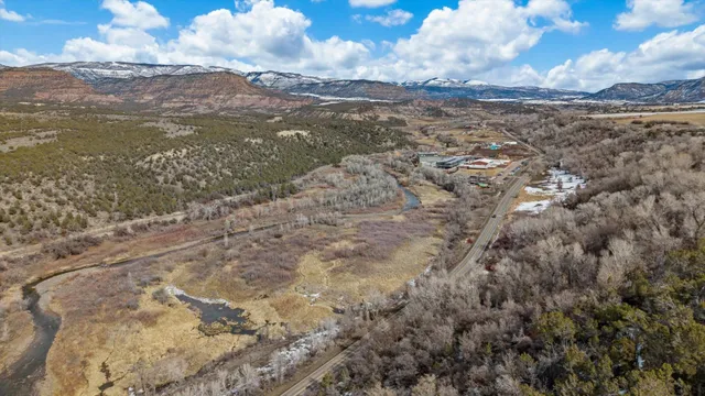 a view of a table and chairs in the garden