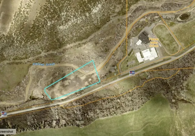 a view of lake with green space