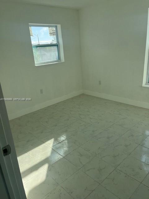 435 Southwest 9th Avenue, Unit 209 Homestead, FL 33030 - Photo 4 of 6 a bathroom with a toilet