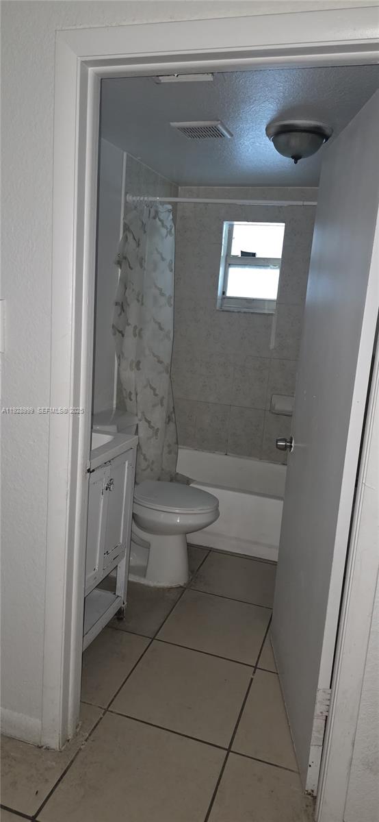 435 Southwest 9th Avenue, Unit 209 Homestead, FL 33030 - Photo 4 of 8 a bathroom with a toilet and a shower