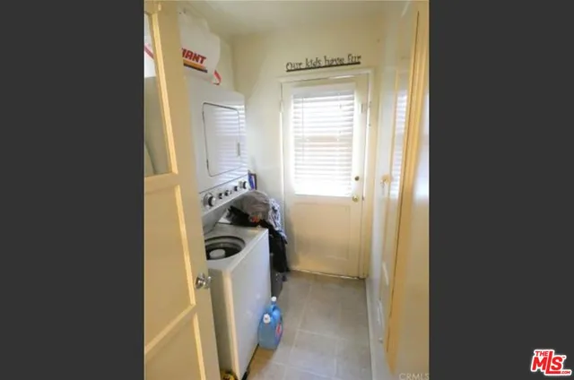 a view of a storage & utility room with a window