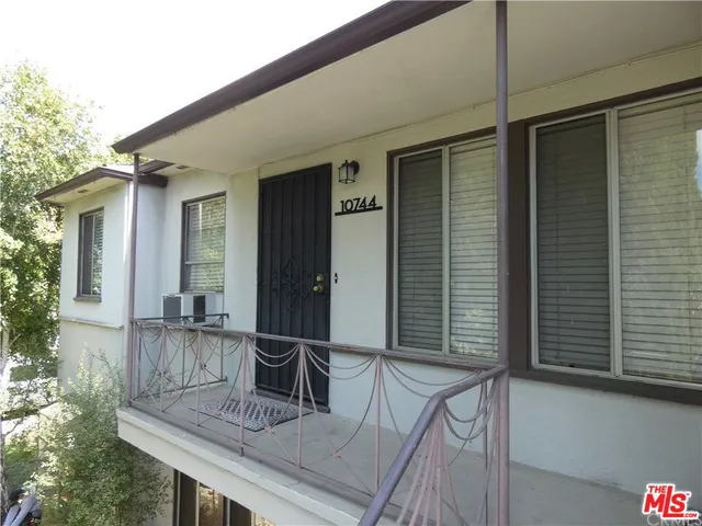 a view of house with chair and table