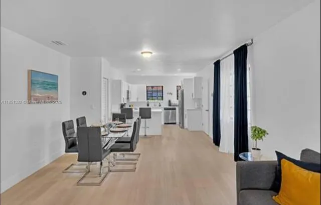 a view of a living room filled with furniture