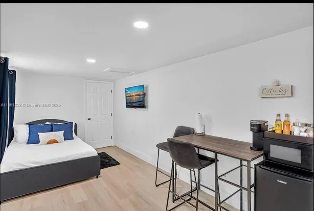 a bedroom with a bed and a table in it