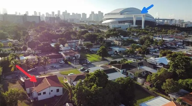 an aerial view of residential houses with outdoor space
