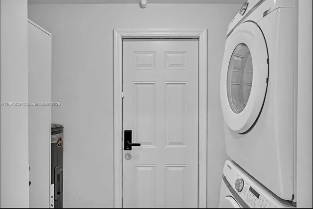 a close view of a utility room with dryer and washer