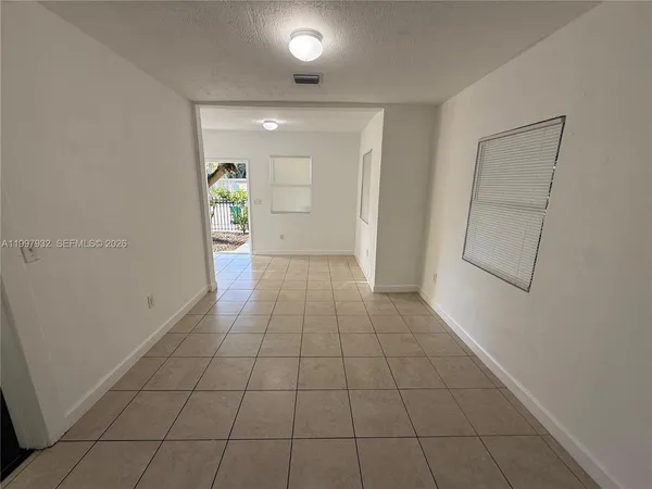 a view of an empty room and window