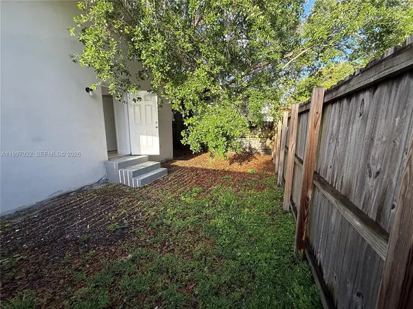 a backyard of a house with lots of green space