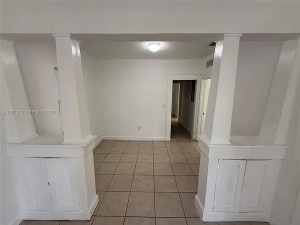 a view of an empty room and entryway
