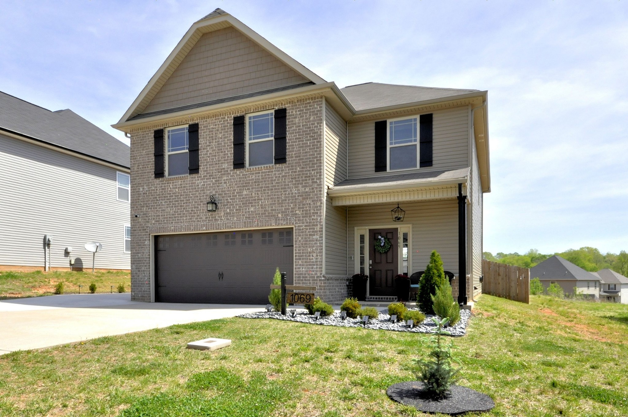 a front view of a house with a yard