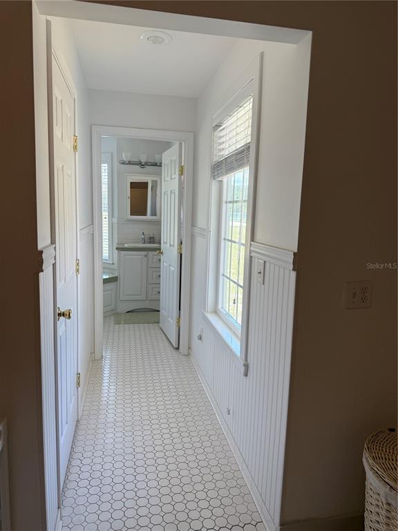 7390 South Mc Alpin Road McAlpin, FL 32062 - Photo 12 of 53 a view of a hallway with a hardwood and front door