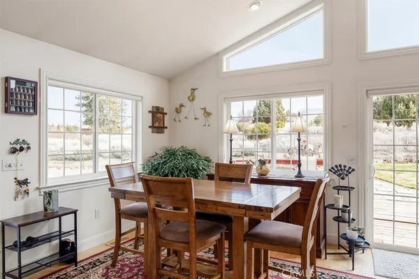 a kitchen with a refrigerator sink and cabinets