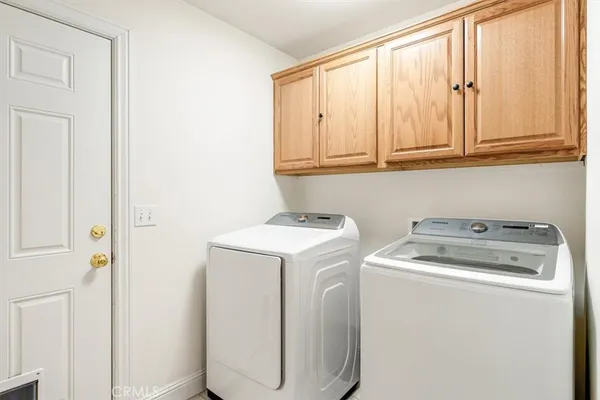 wooden floor with view of living room