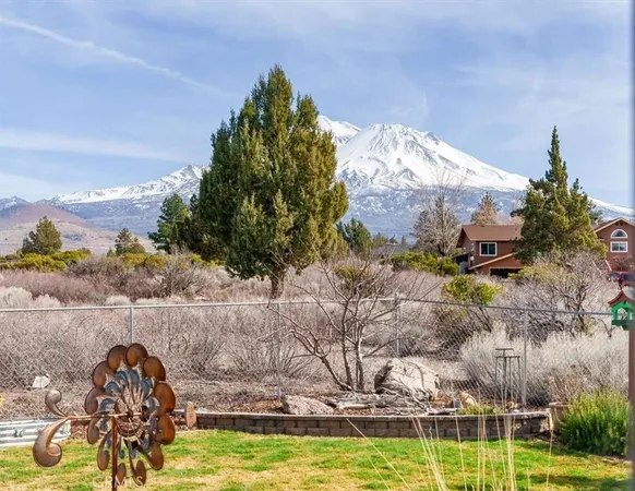 a view of a swimming pool with a yard