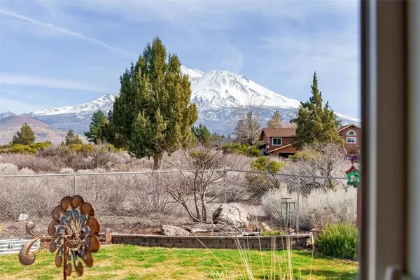 a view of a swimming pool with a yard
