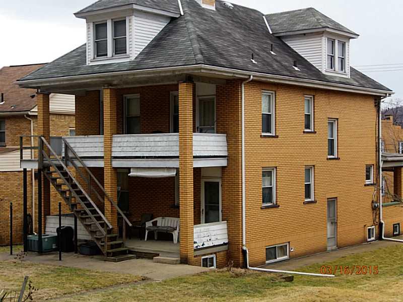 1414 Beaver Road Ambridge, PA 15003 - Photo 2 of 13 Exterior Back. Stairs lead to what could be turned back into a second floor apartment.