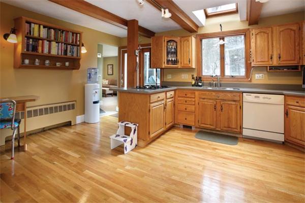 69 Morse Road Newton, MA 02460 - Photo 4 of 11 a large kitchen with stainless steel appliances granite countertop a stove a sink and a refrigerator