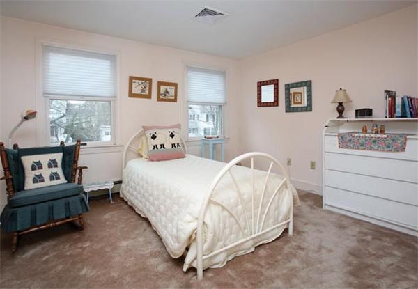 69 Morse Road Newton, MA 02460 - Photo 10 of 11 a bedroom with a bed and a lamp on table