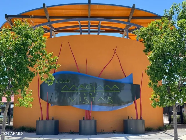 a view of a swimming pool with a bench