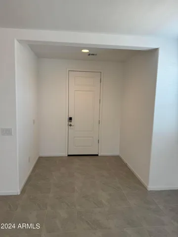 a kitchen with a refrigerator sink and cabinets