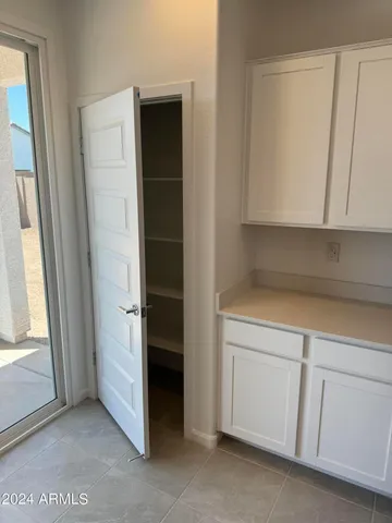 a kitchen with stainless steel appliances wooden cabinets and a sink