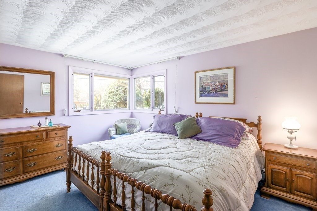 617 Edgell Road Framingham, MA 01701 - Photo 13 of 26 a bedroom with a bed a dresser and next to a window