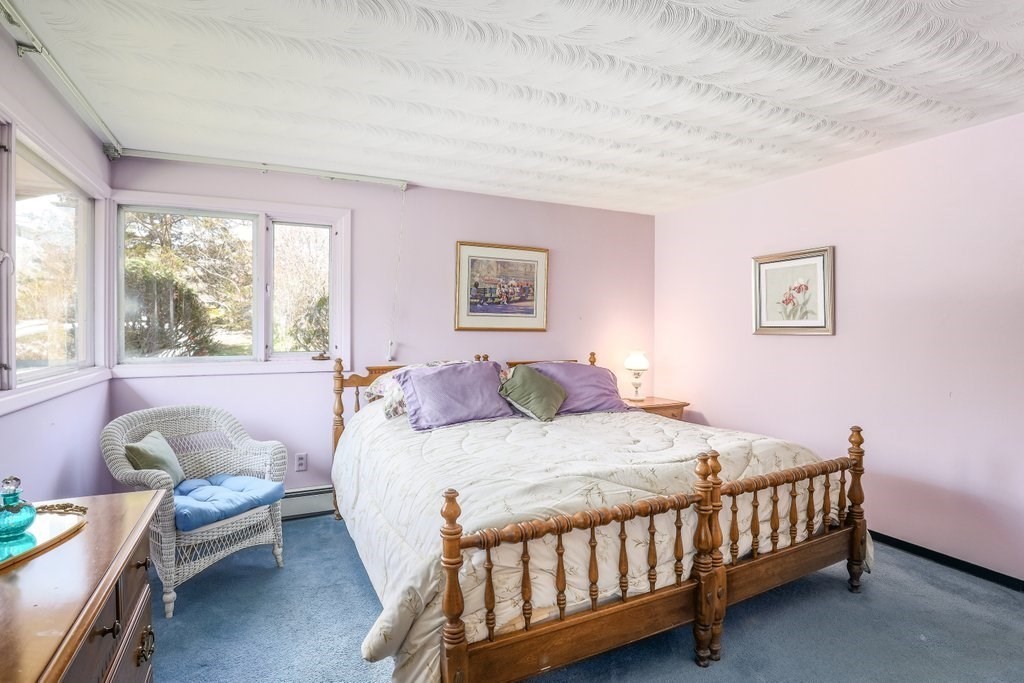 617 Edgell Road Framingham, MA 01701 - Photo 14 of 26 a bedroom with a bed and a window