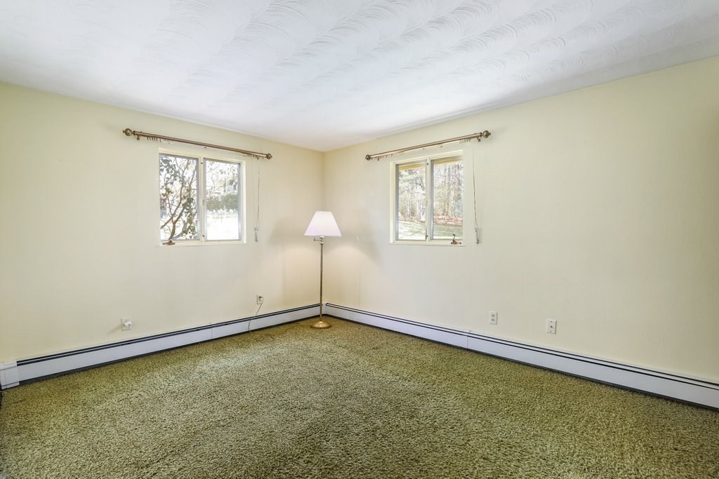 617 Edgell Road Framingham, MA 01701 - Photo 17 of 26 an empty room with windows