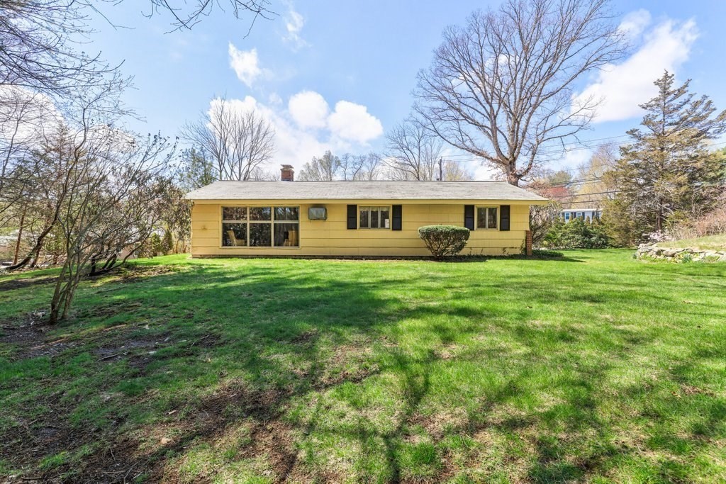 617 Edgell Road Framingham, MA 01701 - Photo 22 of 26 a view of house with yard and trees in the background