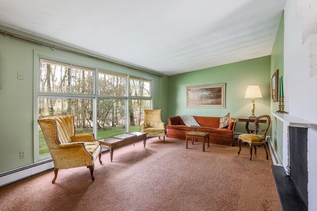 617 Edgell Road Framingham, MA 01701 - Photo 4 of 26 a living room with furniture and a large window