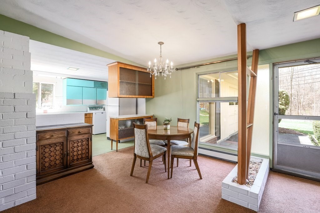 617 Edgell Road Framingham, MA 01701 - Photo 7 of 26 a view of a dining room with furniture window and outside view