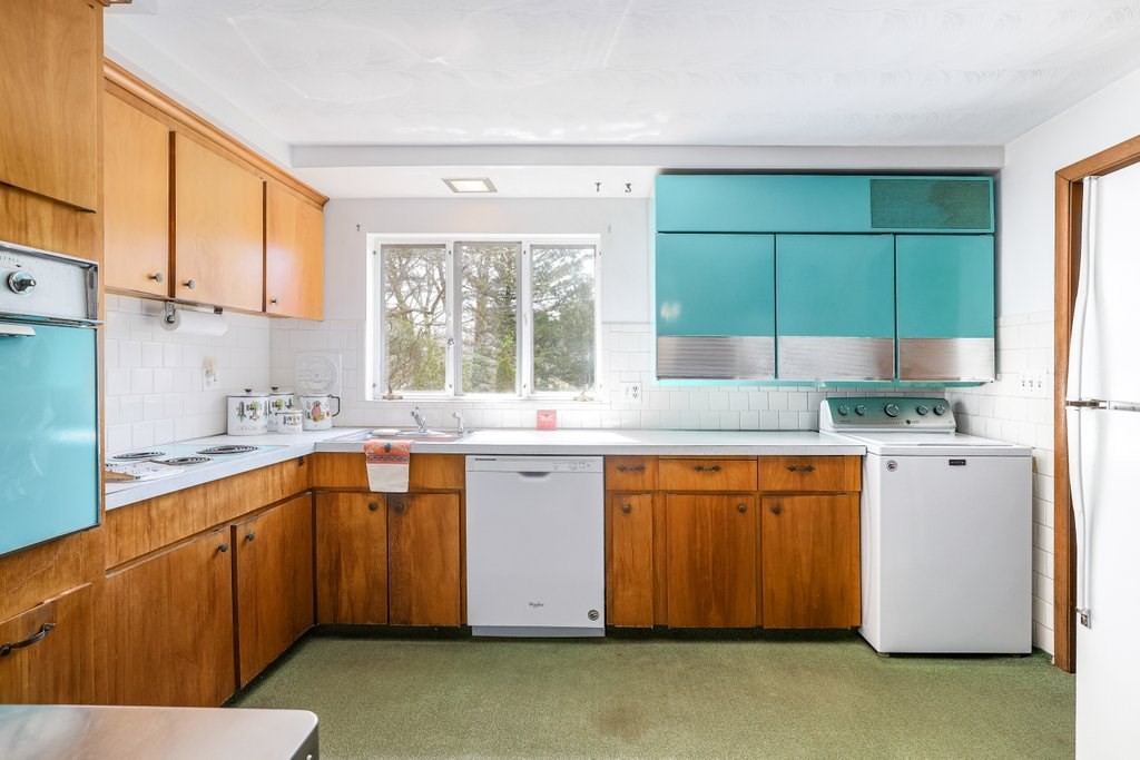 617 Edgell Road Framingham, MA 01701 - Photo 10 of 26 a kitchen with stainless steel appliances granite countertop a sink and a refrigerator