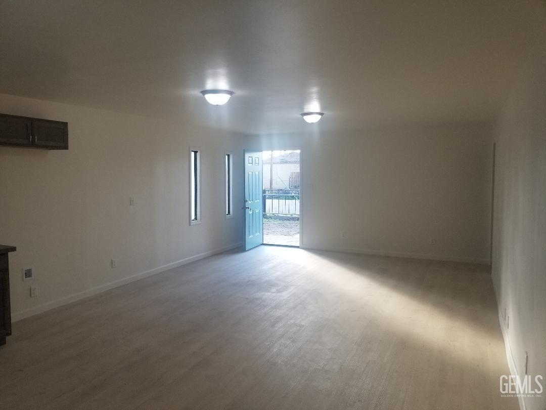 Undisclosed Address Bakersfield, CA 93304 - Photo 4 of 9 a view of empty room with windows