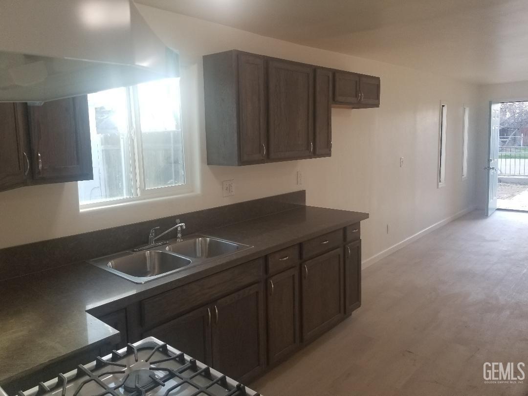 Undisclosed Address Bakersfield, CA 93304 - Photo 5 of 9 a bathroom with a sink and a window