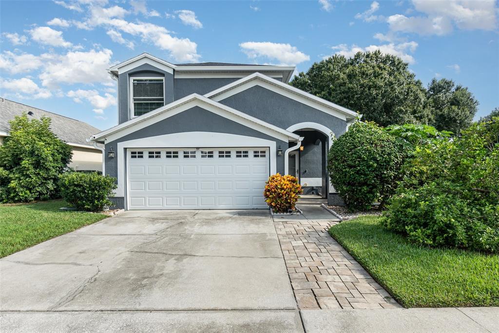 210 Imperial Ridge Court Oviedo, FL 32765 - Photo 1 of 1 a front view of a house with garden