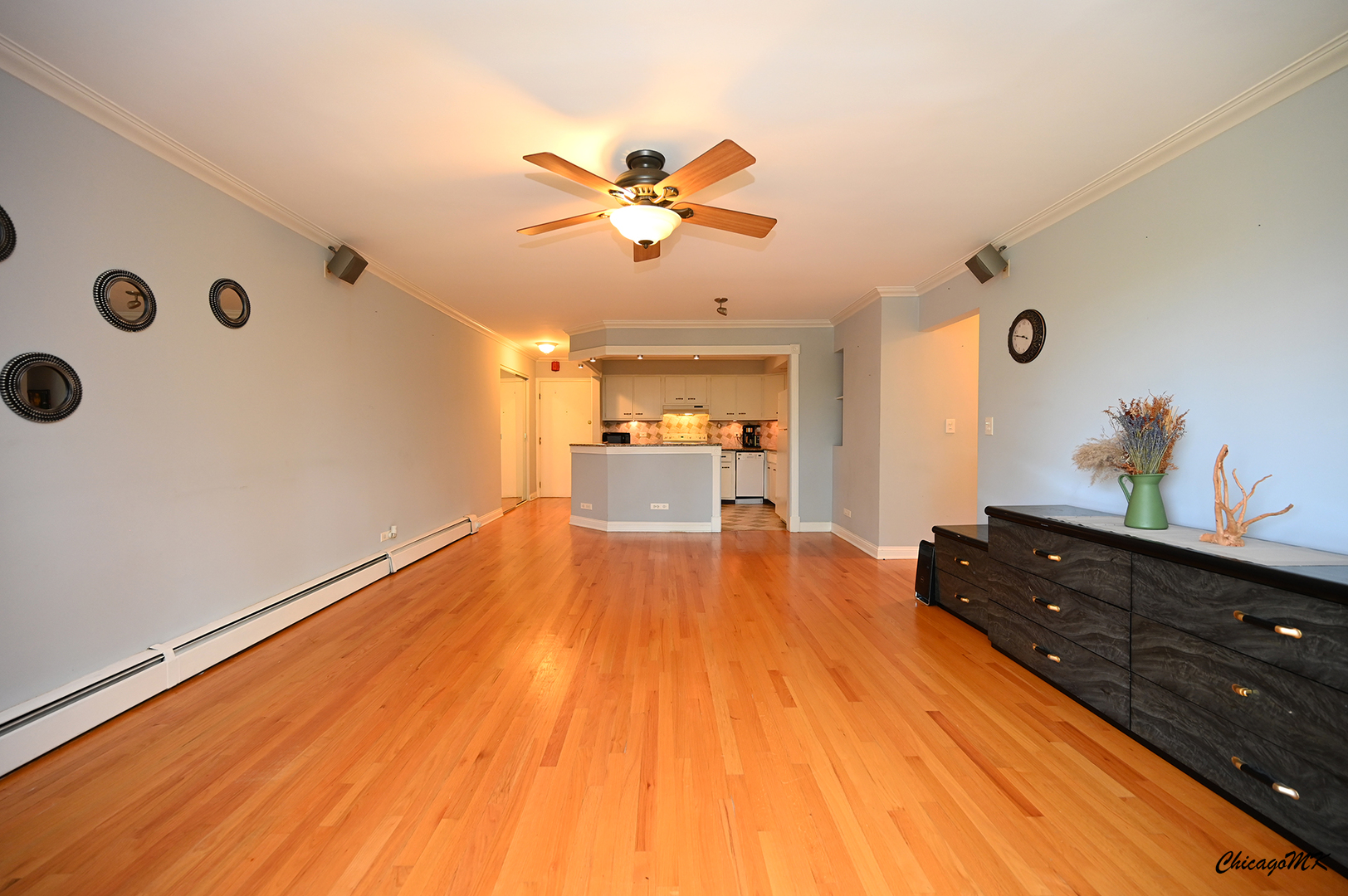 2234 South Goebbert Road, Unit 422 Arlington Heights, IL 60005 - Photo 5 of 27 a spacious bedroom with a bed and wooden floor