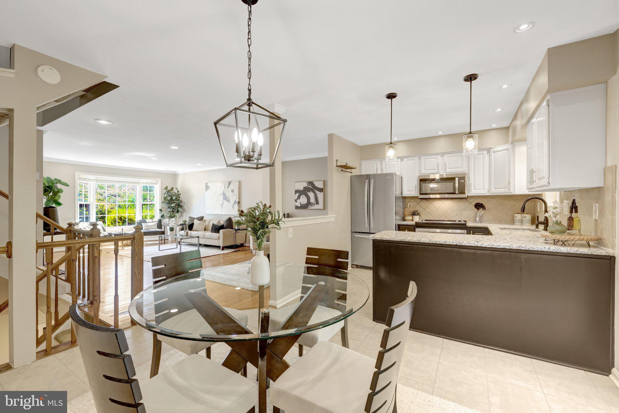 11992 Sentinel Point Court Reston, VA 20191 - Photo 12 of 36 Breakfast nook with updated pendant lights