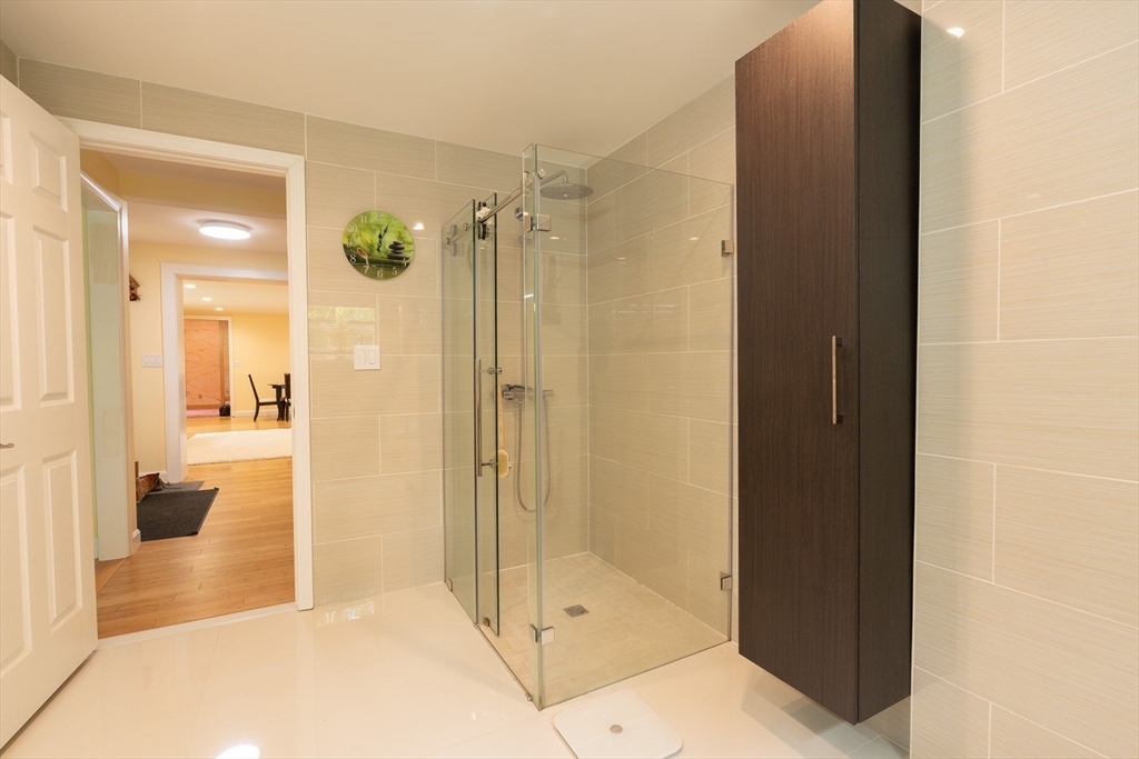 5 Fairview Road Canton, MA 02021 - Photo 14 of 28 a bathroom with a shower and a glass door