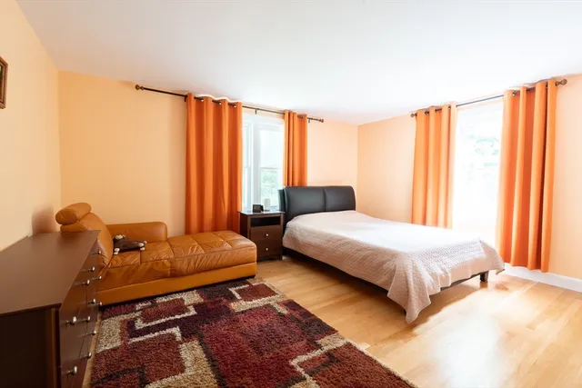 a bedroom with a bed and a closet