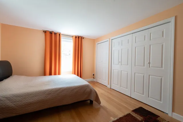 a living room with furniture rug and a window