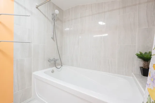 a bathroom with a sink vanity and a mirror