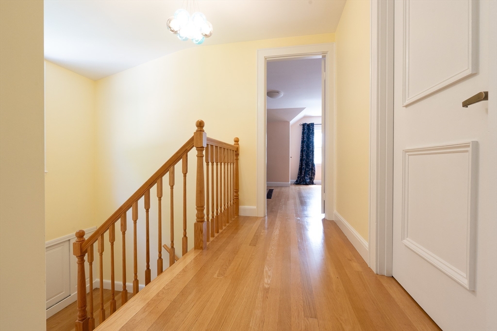 5 Fairview Road Canton, MA 02021 - Photo 24 of 28 a view of a hallway with wooden floor and staircase