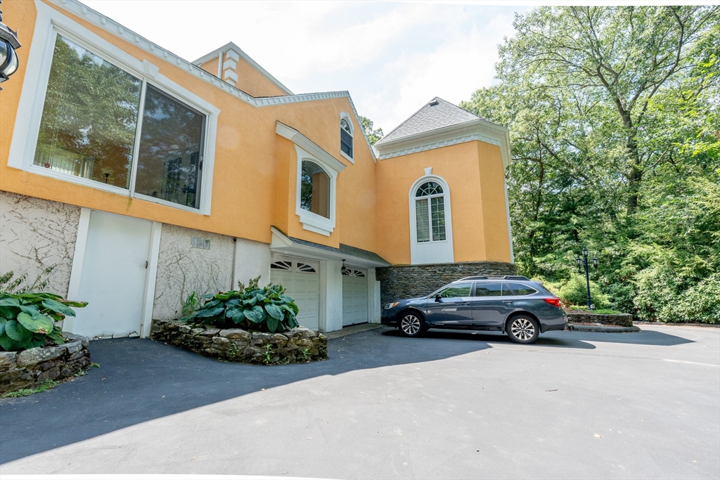 5 Fairview Road Canton, MA 02021 - Photo 26 of 28 a car parked in front of a house