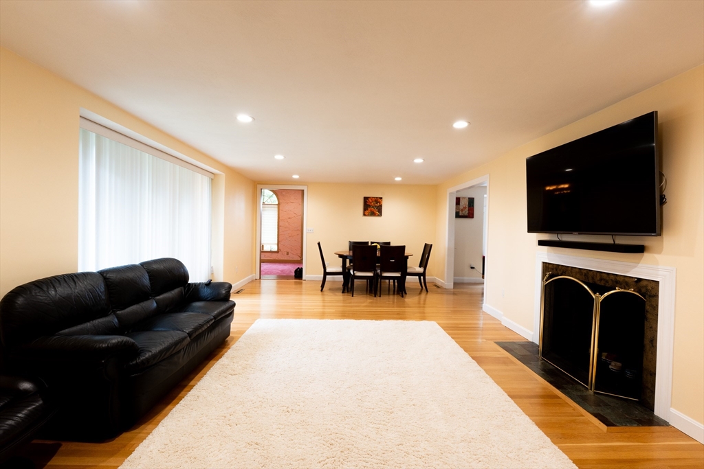 5 Fairview Road Canton, MA 02021 - Photo 3 of 28 a living room with furniture and a flat screen tv
