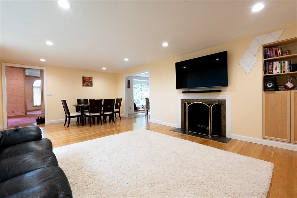 5 Fairview Road Canton, MA 02021 - Photo 4 of 28 a living room with furniture a flat screen tv and a fireplace
