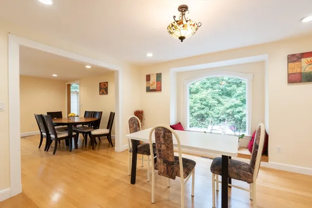 a kitchen with stainless steel appliances kitchen island granite countertop a stove a sink and a refrigerator